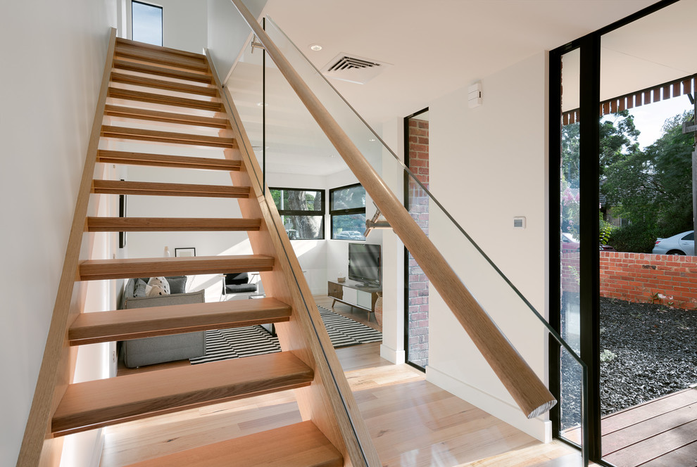 This is an example of a medium sized contemporary staircase in Melbourne.