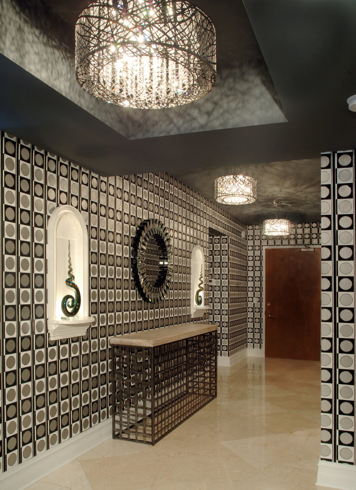 Photo of a large contemporary foyer in Miami with multi-coloured walls, marble flooring, a single front door and a dark wood front door.