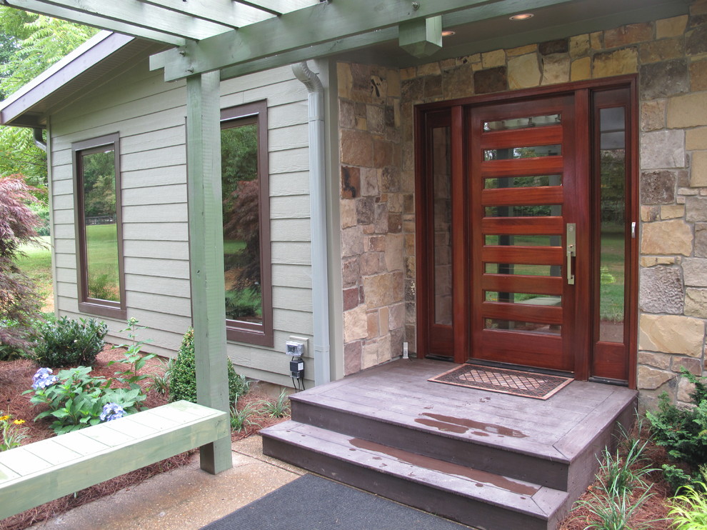 Inspiration for a mid-sized 1950s entryway remodel in Louisville with a dark wood front door