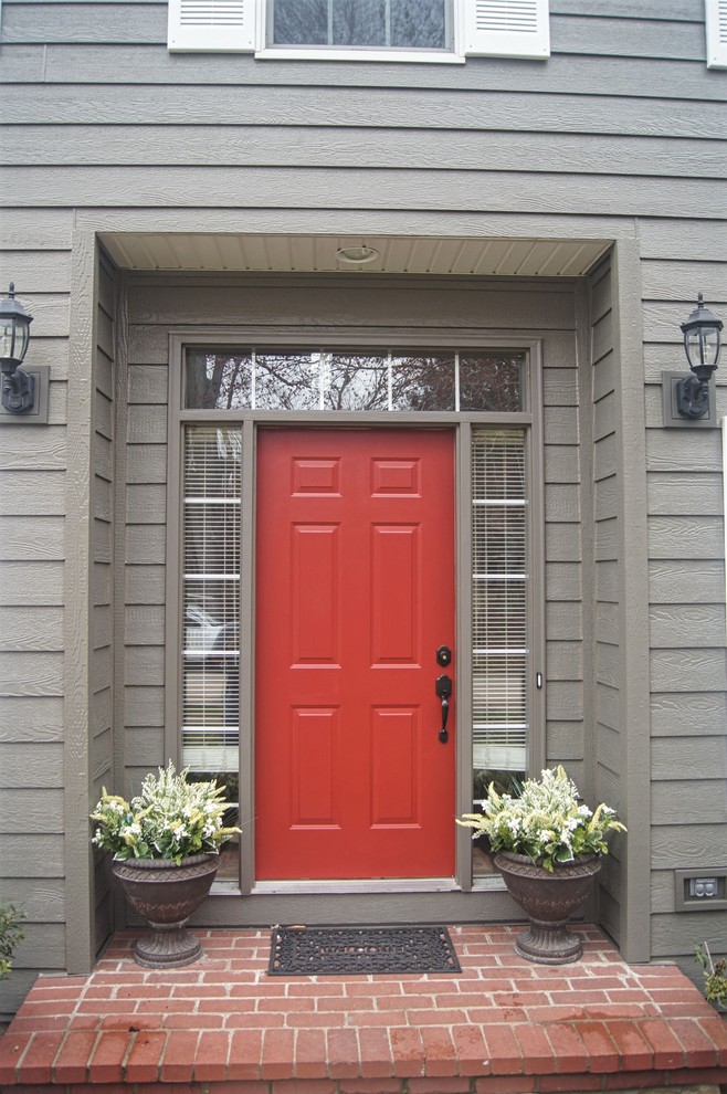 Entryway - traditional entryway idea in Other with a red front door