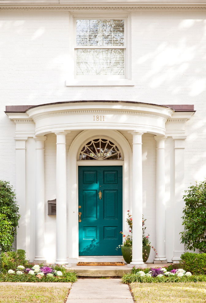 Inspiration for a timeless front door remodel in Other with a blue front door