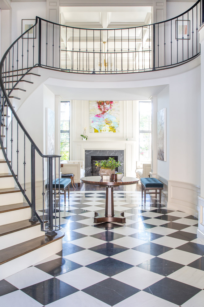 This is an example of a traditional foyer in Los Angeles with white walls.