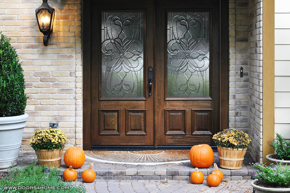 Example of a mid-sized classic entryway design in Austin with a dark wood front door