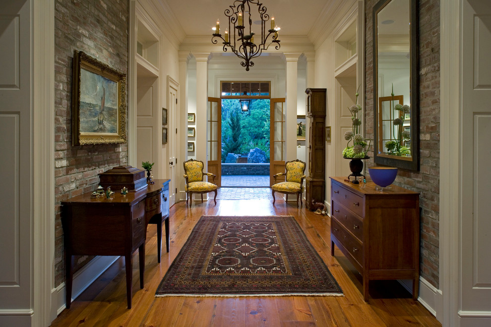 Large classic foyer in Other with white walls, medium hardwood flooring, a double front door and a medium wood front door.