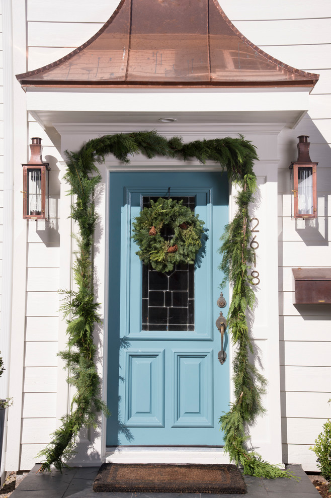 Entryway - traditional entryway idea in Houston with a blue front door