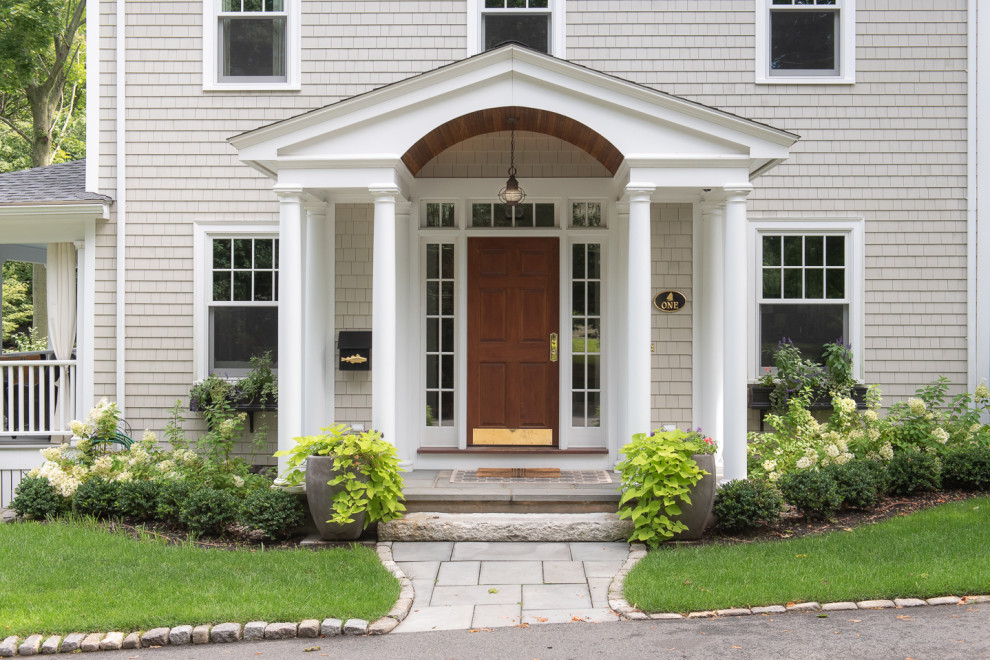 Design ideas for a large traditional front door in Boston with a single front door and a dark wood front door.