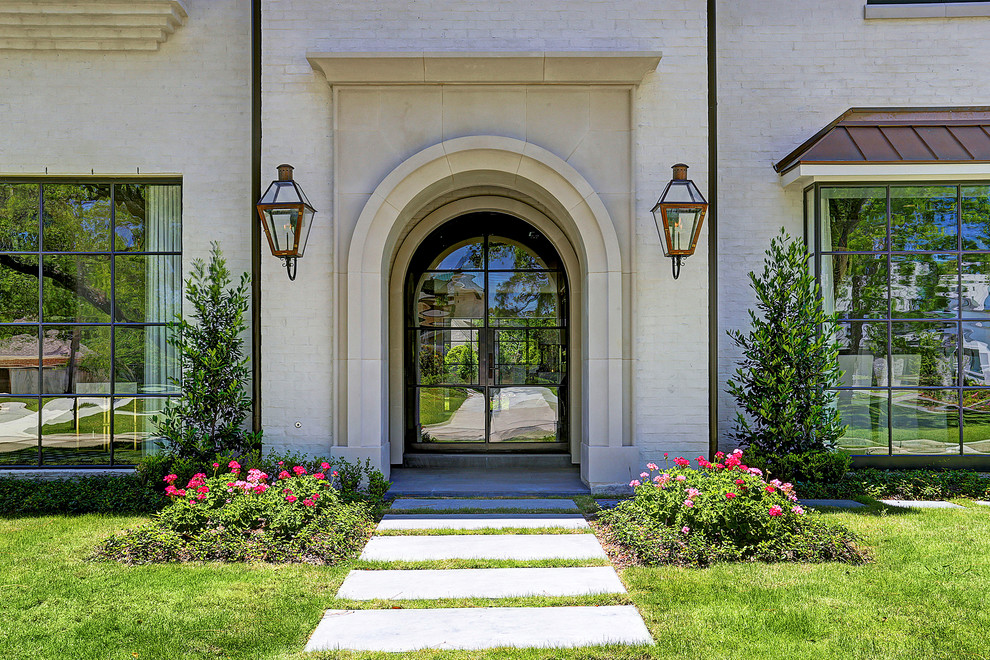 This is an example of a traditional front door in Houston with a double front door and a glass front door.