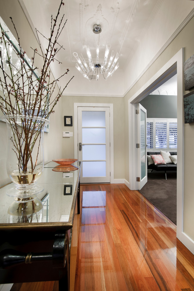 Design ideas for a classic hallway in Perth with light hardwood flooring, a single front door and a glass front door.