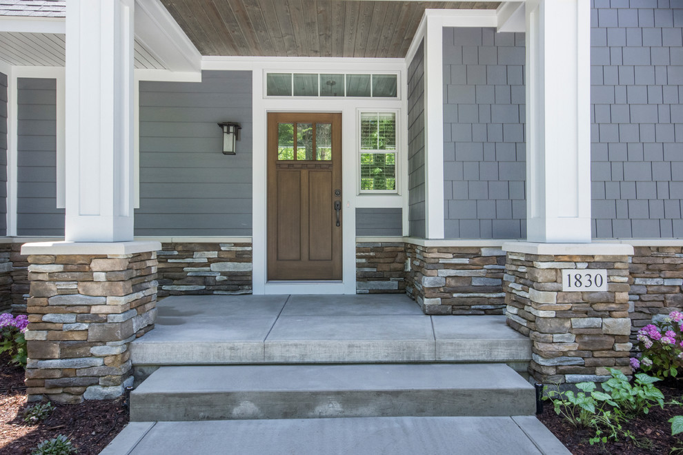 Inspiration for a mid-sized transitional single front door remodel in Grand Rapids