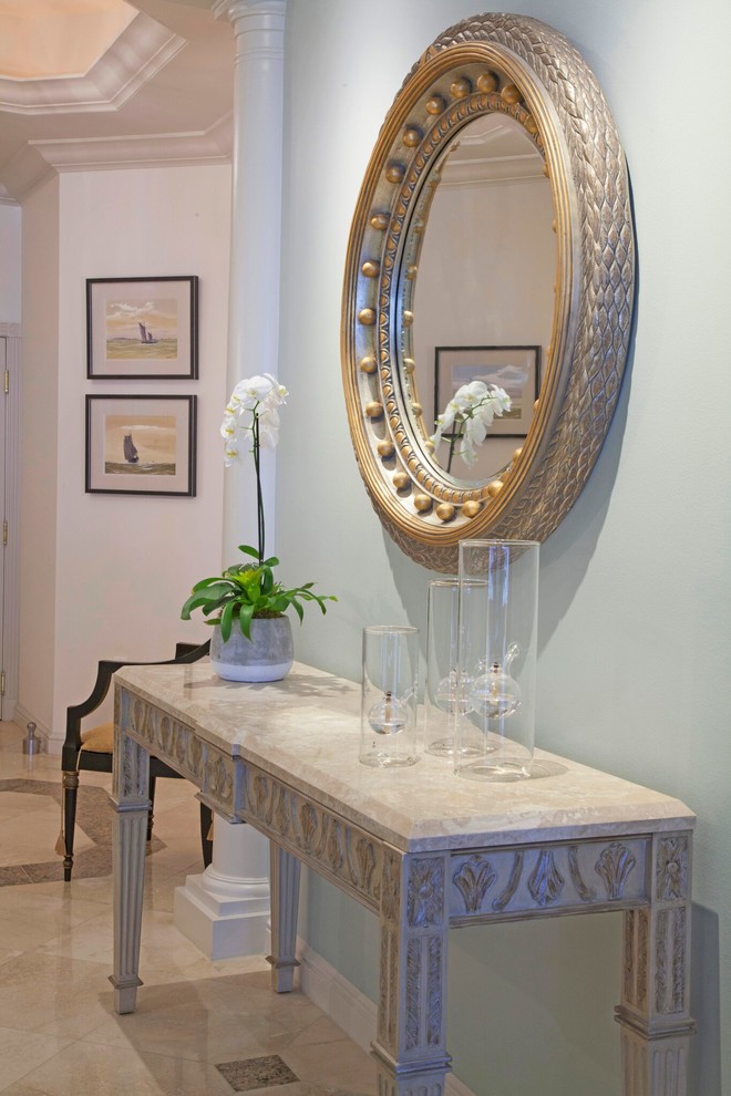 Inspiration for a mid-sized transitional porcelain tile and beige floor foyer remodel in New York with white walls