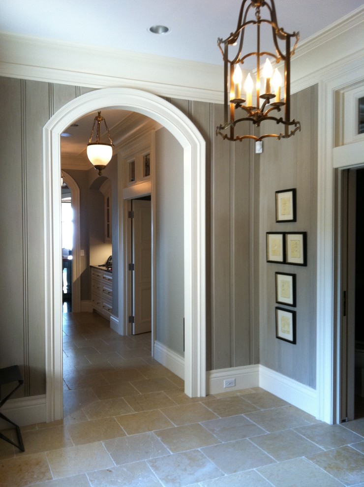 Large classic foyer in Milwaukee with grey walls, porcelain flooring, a double front door and a dark wood front door.