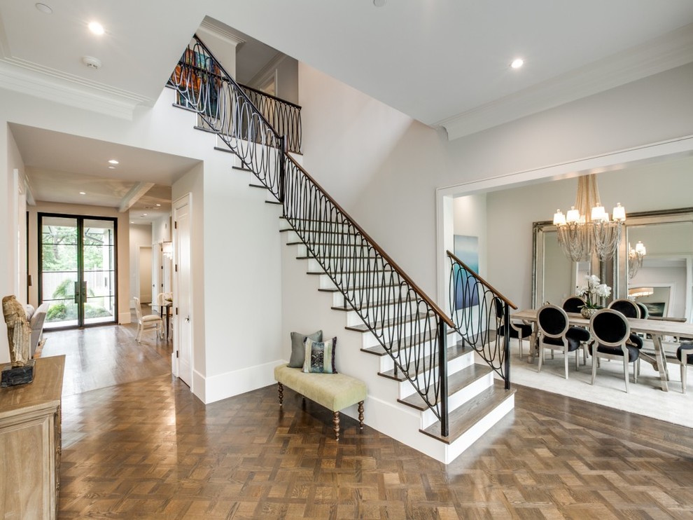 Inspiration for a mid-sized transitional medium tone wood floor entryway remodel in Dallas with gray walls and a black front door