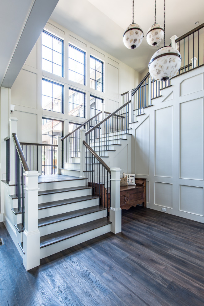 This is an example of a traditional staircase in Other with wainscoting.