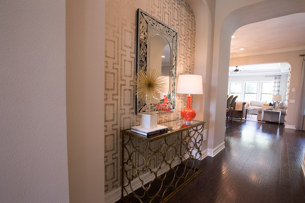 Inspiration for a mid-sized transitional dark wood floor foyer remodel in Tampa with beige walls