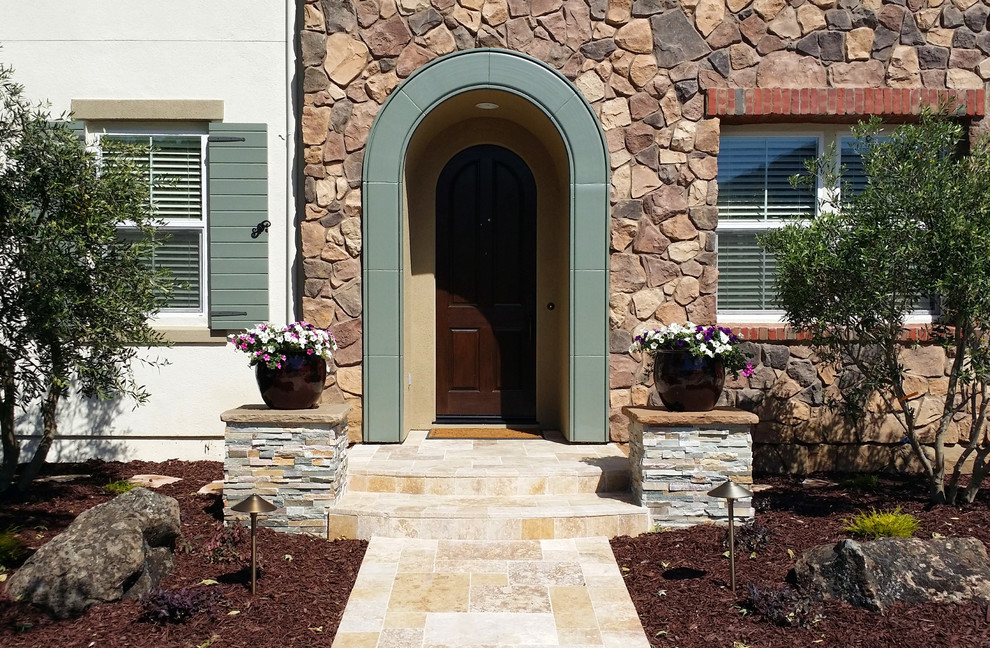 Travertine and Paver Patio with Veneer Stone Walls - Traditional ...