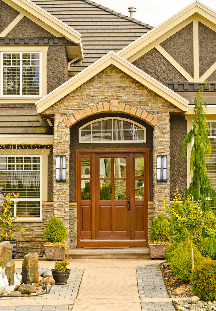 This is an example of a classic front door in New York with a single front door and a medium wood front door.