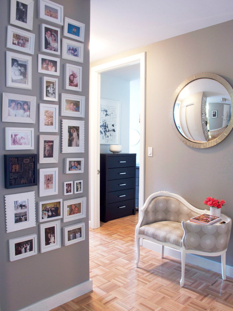 Inspiration for an eclectic light wood floor entryway remodel in New York with gray walls