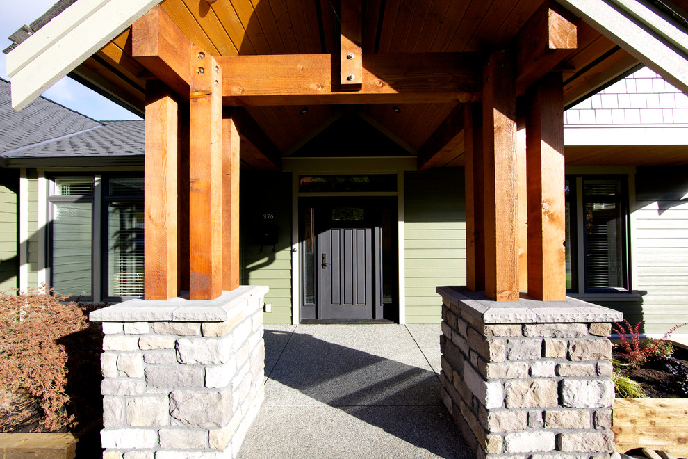 Example of a classic entryway design in Vancouver with a black front door