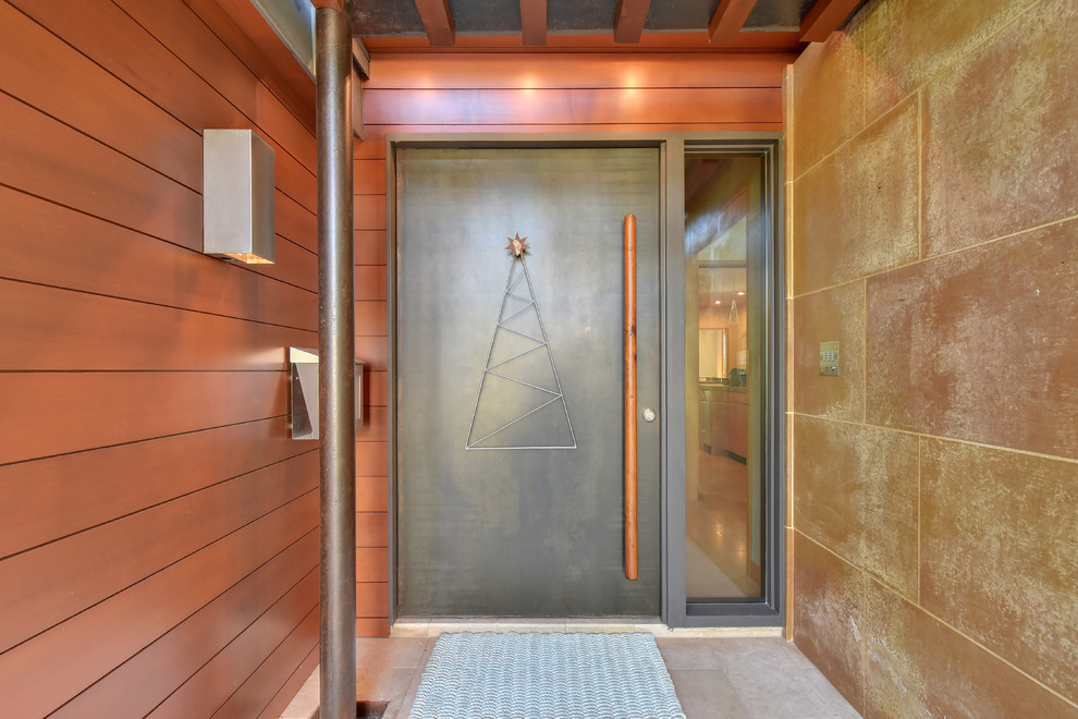 Inspiration for a contemporary front door in Austin with a pivot front door and a grey front door.