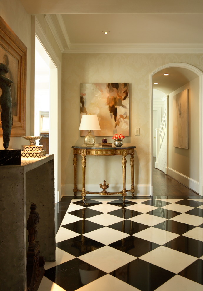 Example of a classic multicolored floor entry hall design in Atlanta with beige walls