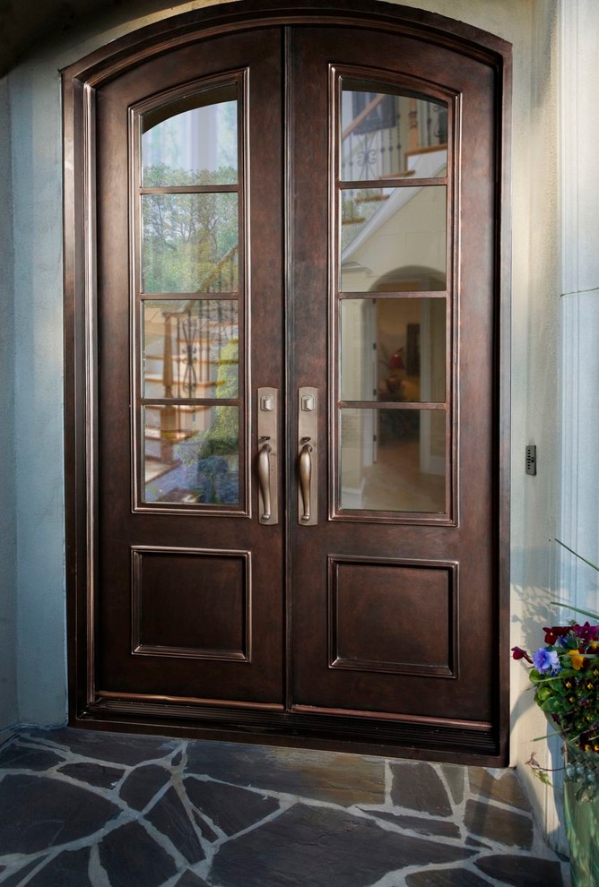 Large entryway photo in Charlotte with a brown front door