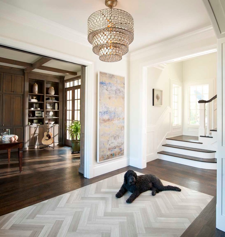 Example of a classic dark wood floor foyer design in Dallas