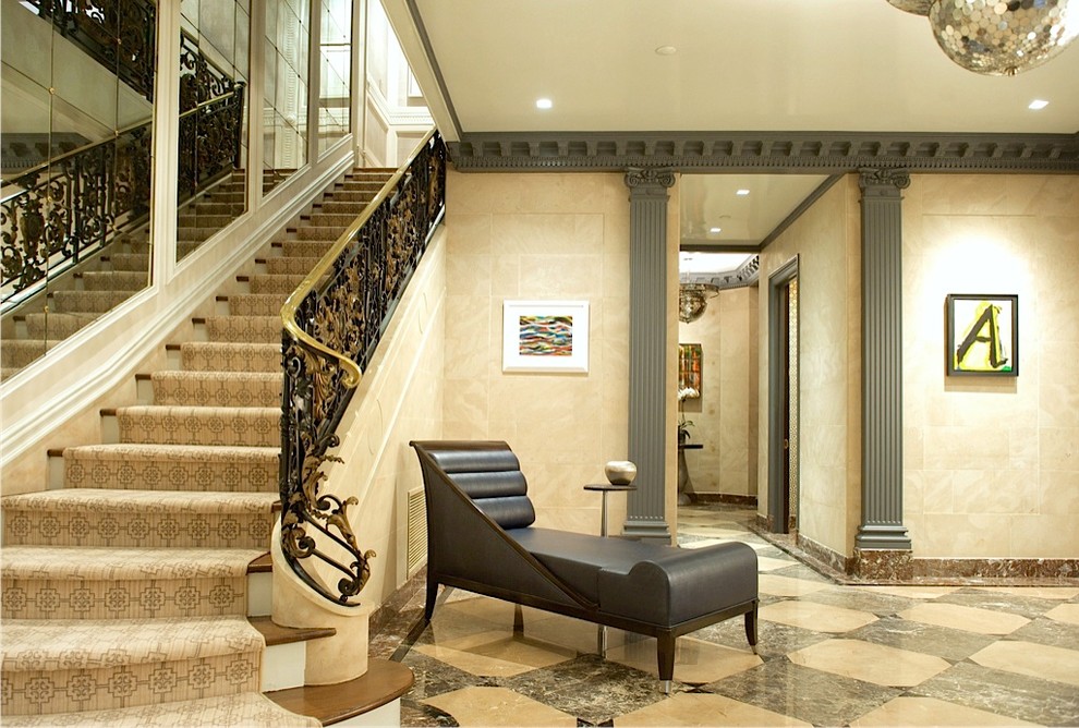Large transitional marble floor foyer photo in New York with beige walls