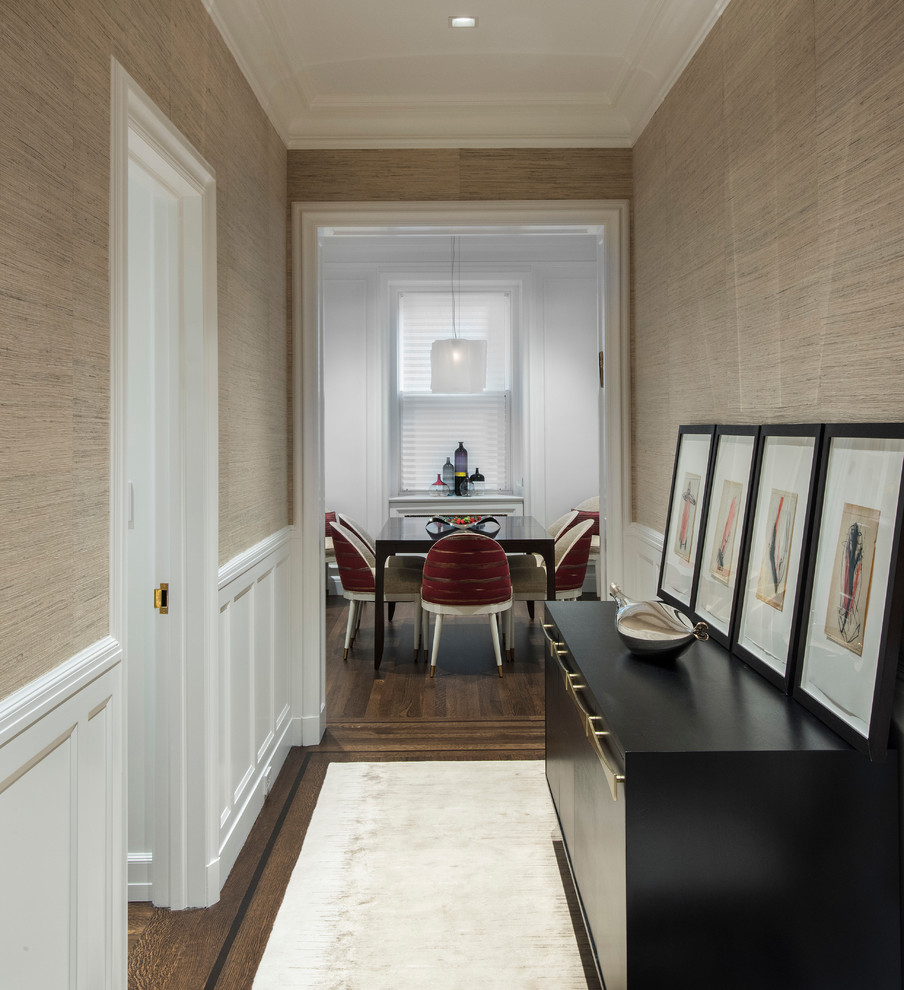 Design ideas for a medium sized traditional foyer in New York with beige walls, brown floors, a single front door, a white front door and medium hardwood flooring.