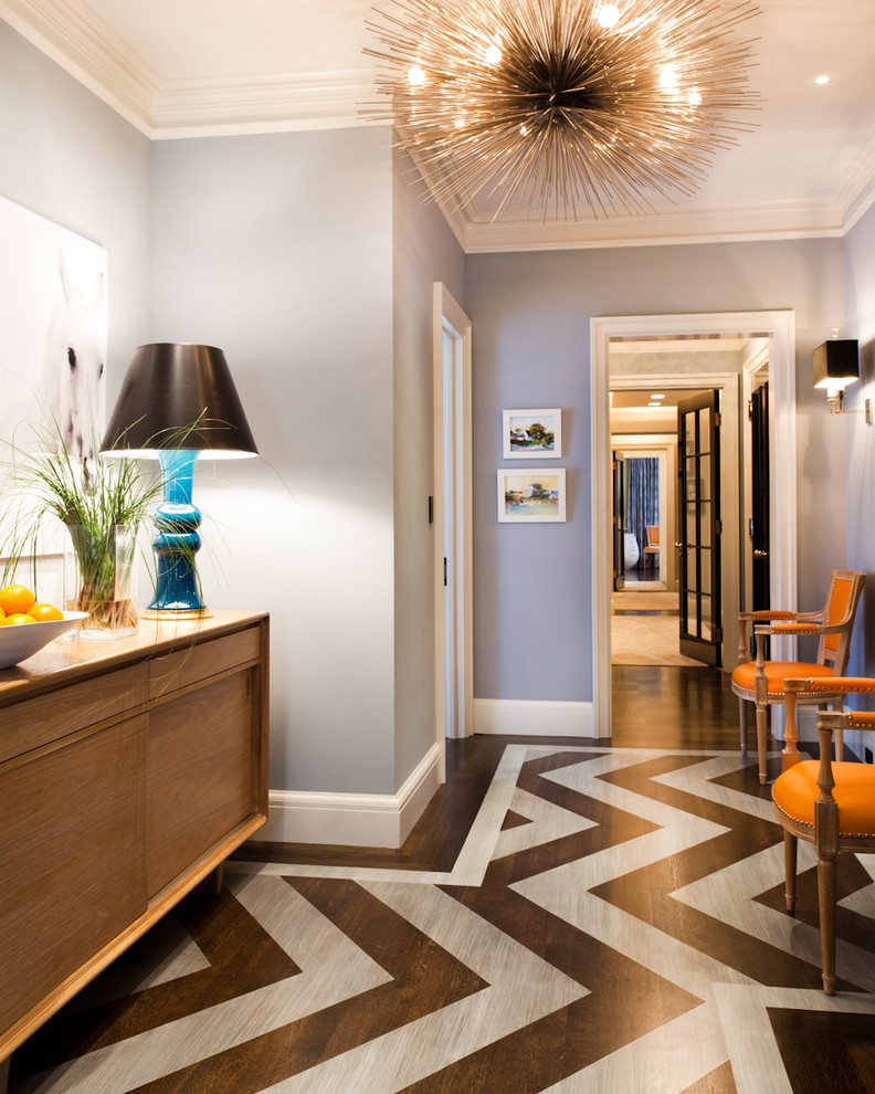 Trendy painted wood floor and multicolored floor entryway photo in New York with gray walls
