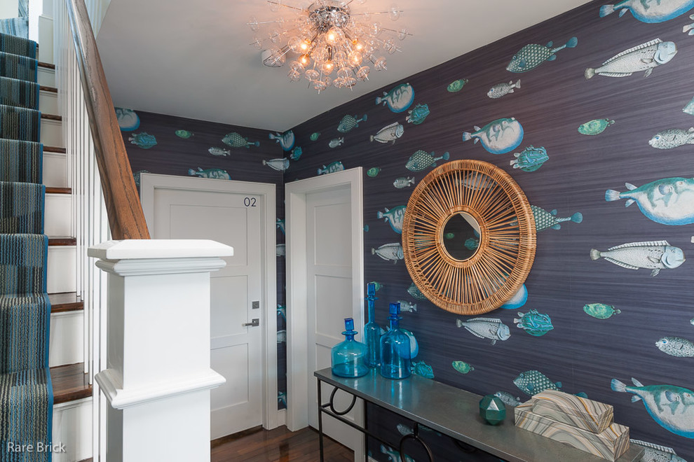 Inspiration for a coastal dark wood floor entryway remodel in Providence with multicolored walls