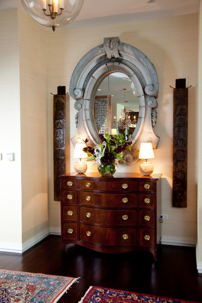 Example of a mid-sized eclectic dark wood floor and brown floor entry hall design in Chicago with beige walls