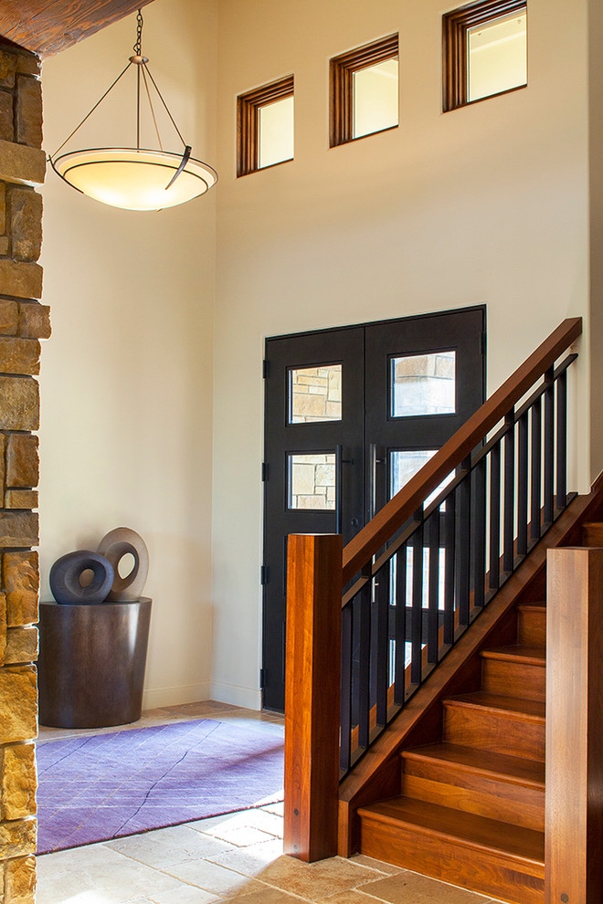 Inspiration for a medium sized contemporary foyer in Austin with beige walls, a double front door and a black front door.
