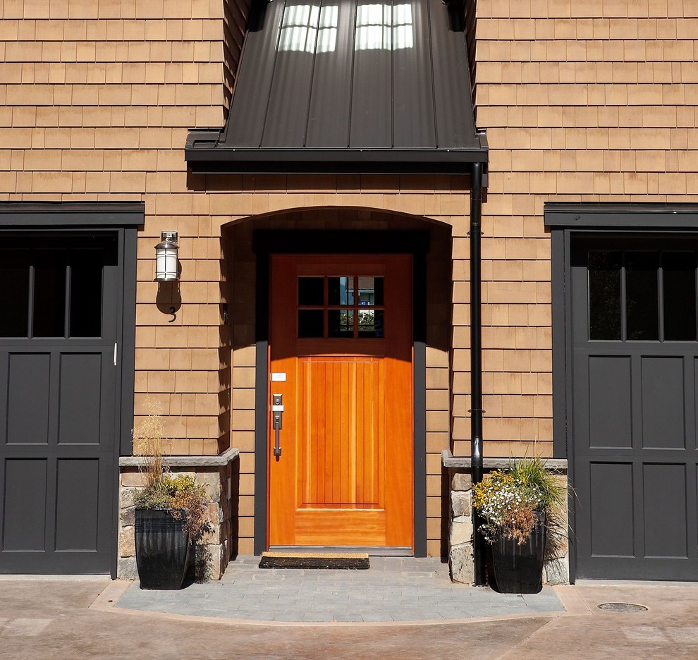Inspiration for a timeless entryway remodel in Seattle with a medium wood front door