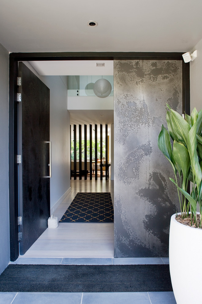 Design ideas for a contemporary front door in Sydney with white walls, a single front door and a black front door.