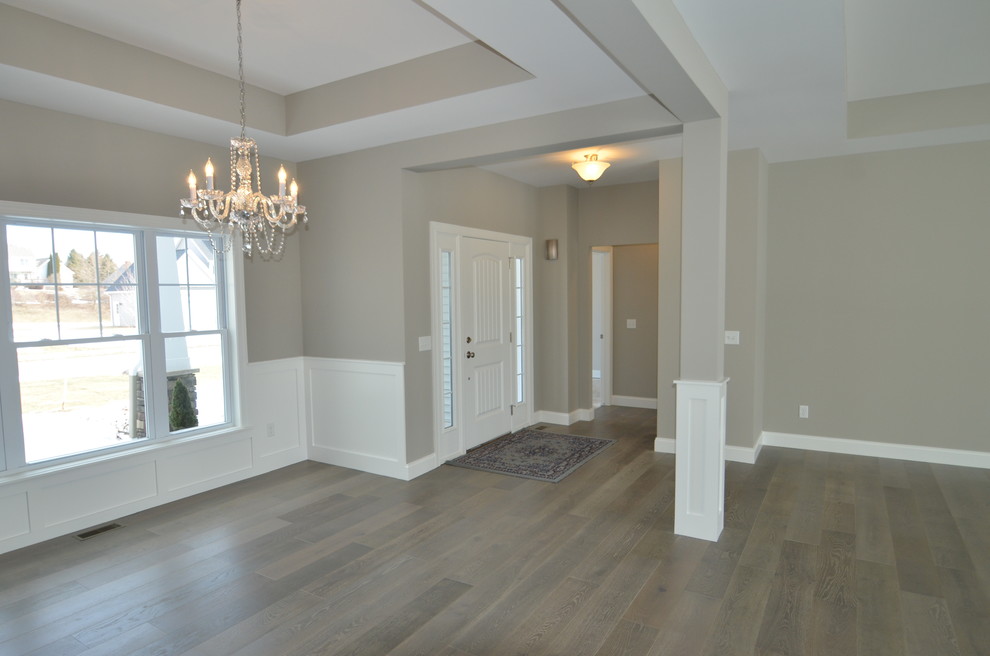 Photo of a large contemporary foyer in Los Angeles with grey walls, medium hardwood flooring, a single front door and a white front door.