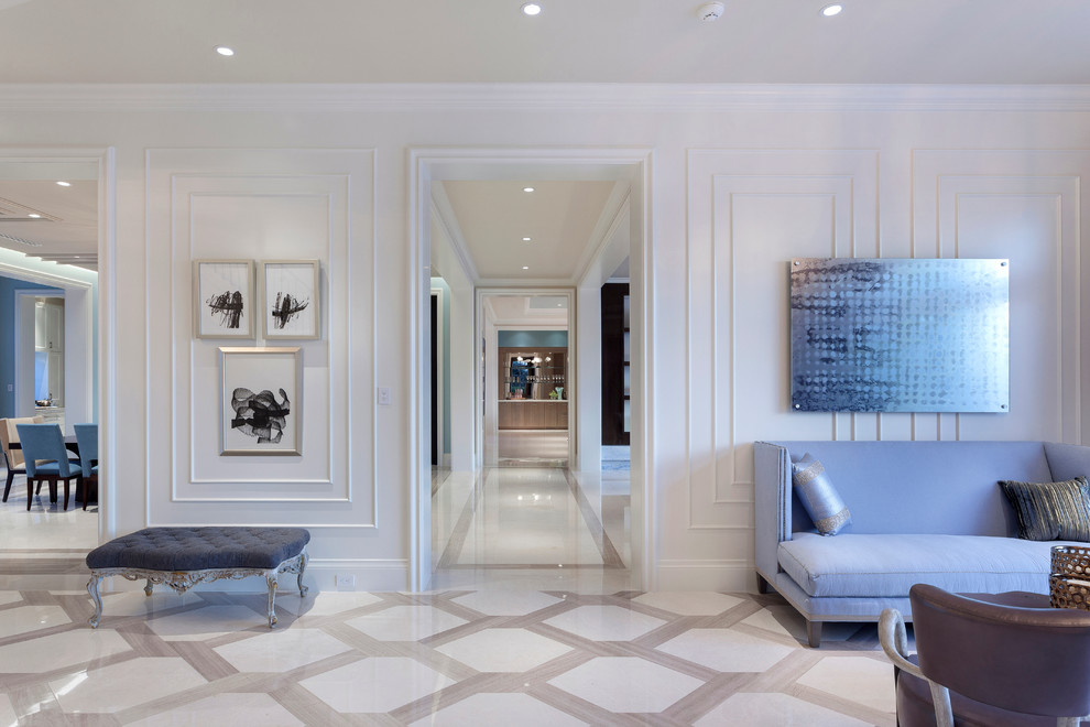 Entryway - huge contemporary marble floor entryway idea in Miami