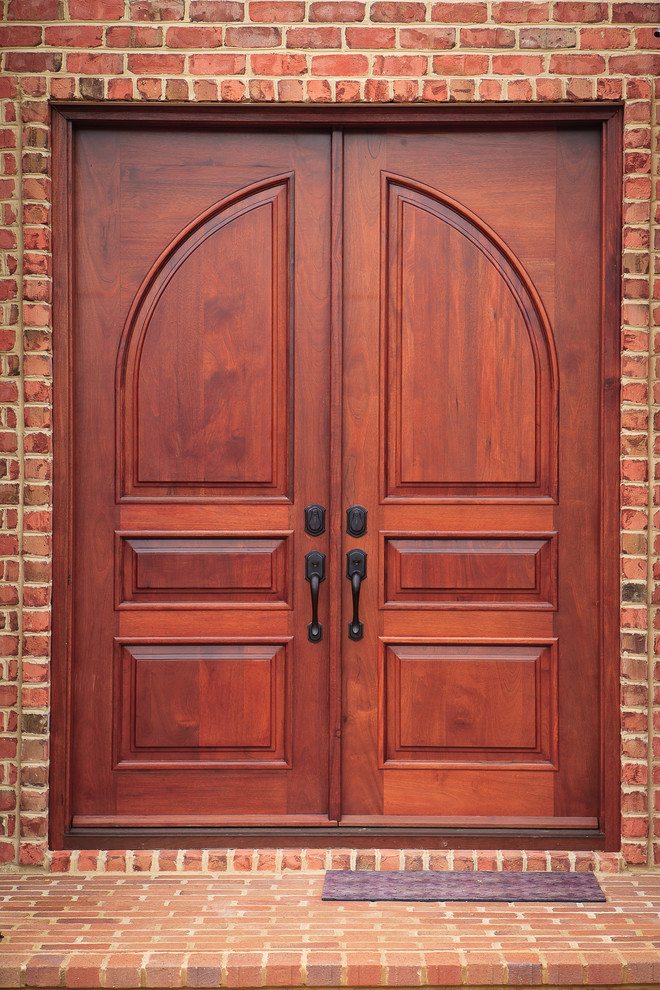 Inspiration for a classic front door in DC Metro with a double front door and a medium wood front door.