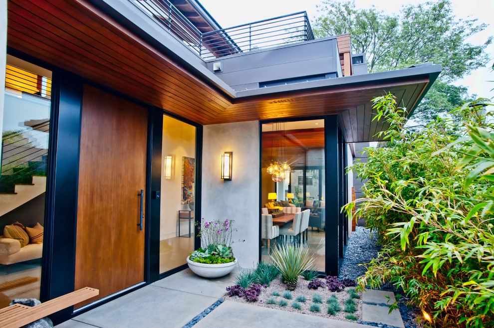 Contemporary front door in Los Angeles with a single front door and a medium wood front door.