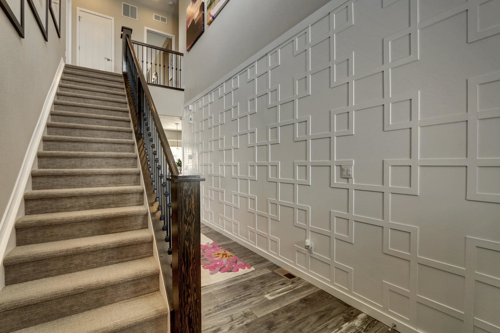 Large transitional porcelain tile entryway photo in Denver with white walls and a gray front door