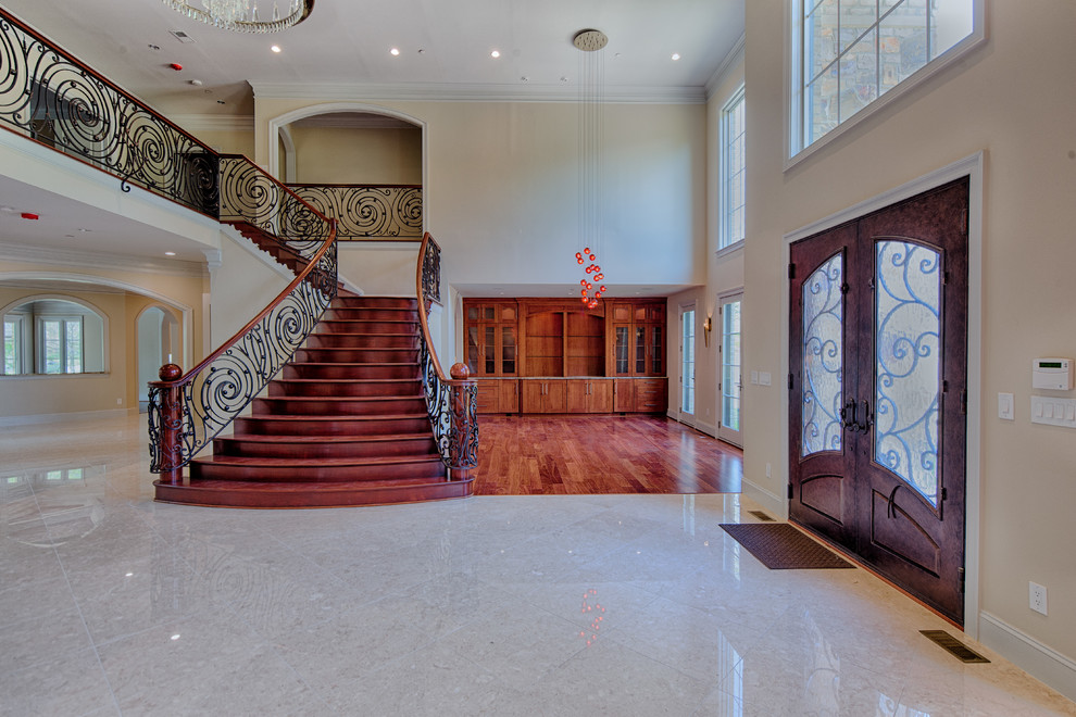 This is an example of an expansive rustic foyer in DC Metro with beige walls, travertine flooring, a double front door and a dark wood front door.