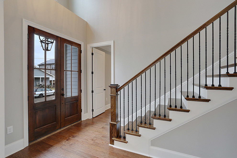 This is an example of a classic foyer in New Orleans with a double front door.