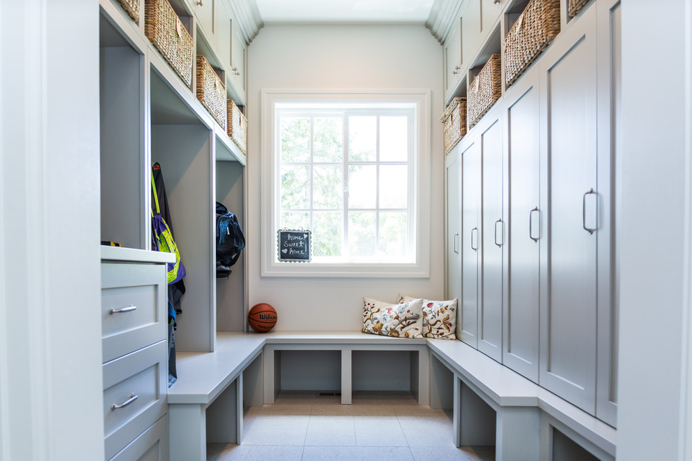 Inspiration for a timeless mudroom remodel in Salt Lake City with white walls