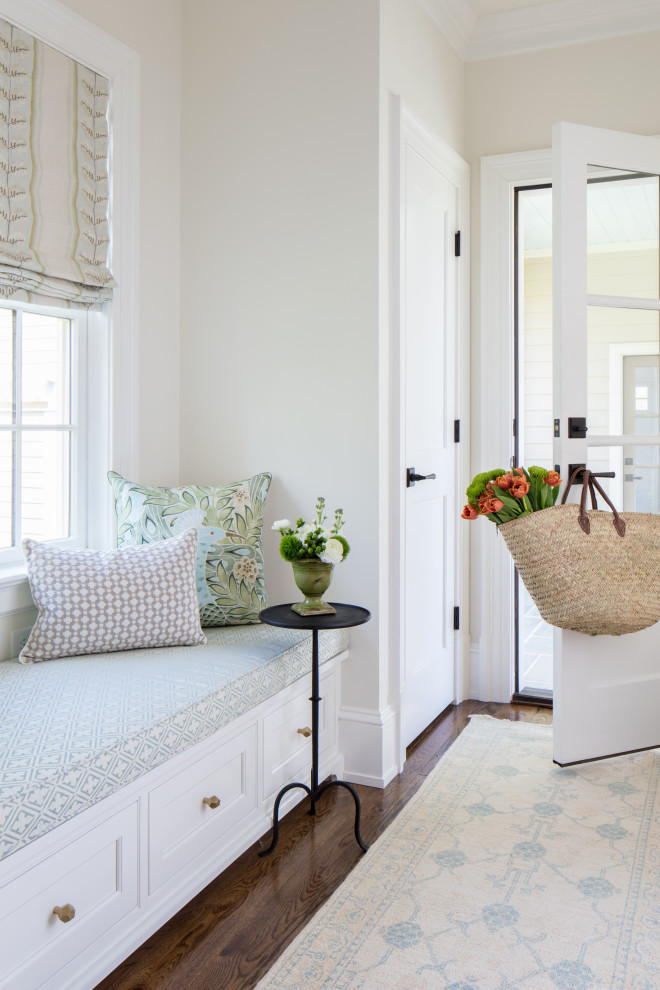Photo of a medium sized beach style hallway in Richmond with white walls, medium hardwood flooring, a single front door, a white front door and brown floors.