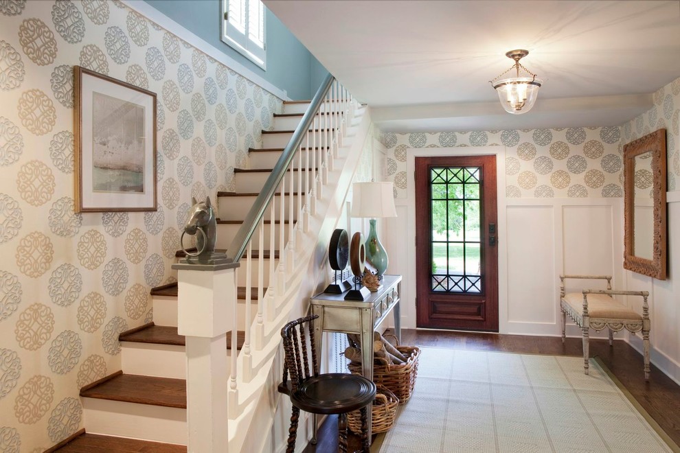 Example of a mid-sized french country medium tone wood floor entryway design in Nashville with a glass front door and blue walls