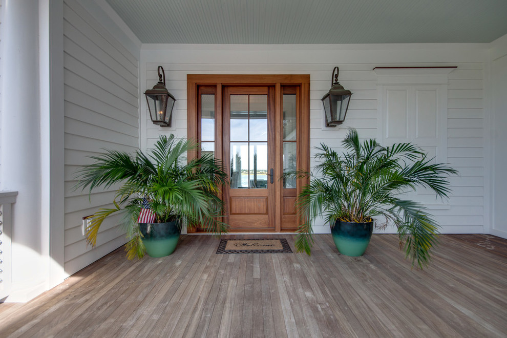 Nautical entrance in Charleston with a single front door and a medium wood front door.