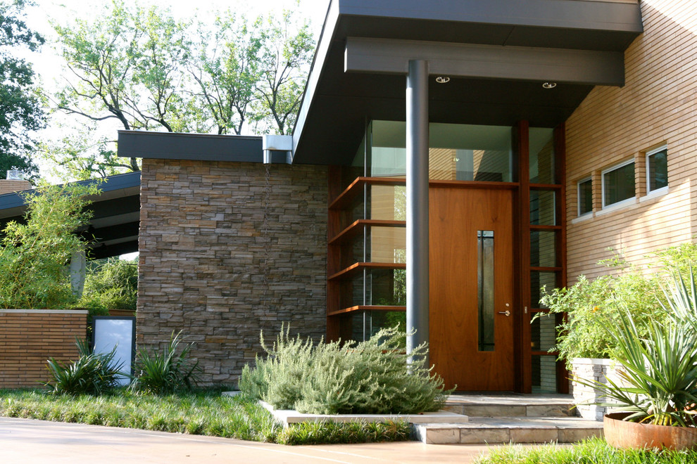 Design ideas for a contemporary entrance in Dallas with a single front door and a medium wood front door.