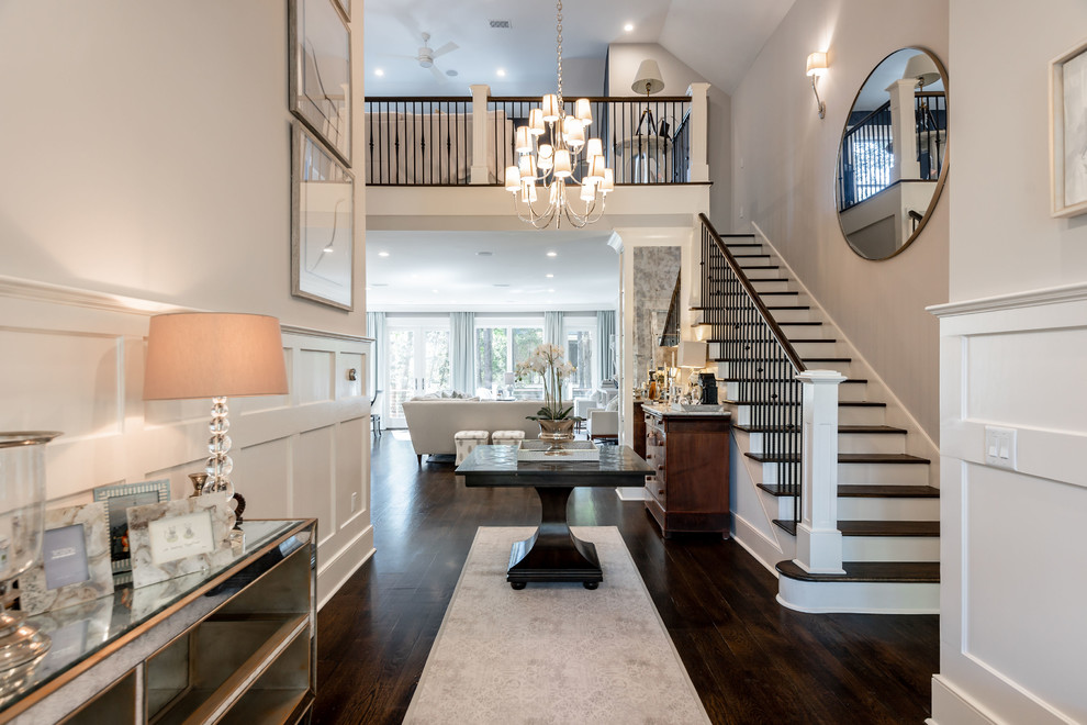 Design ideas for a large classic foyer in Charleston with grey walls, dark hardwood flooring and brown floors.