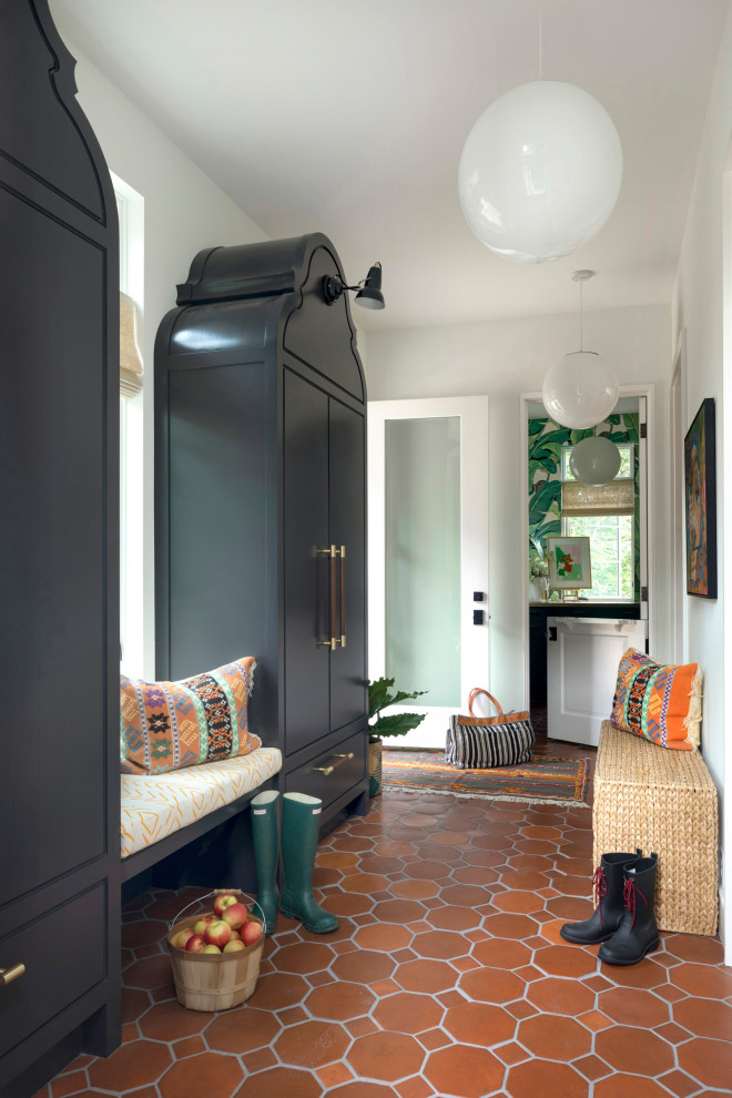 Inspiration for a small bohemian boot room in Minneapolis with white walls, terracotta flooring, a single front door and a white front door.