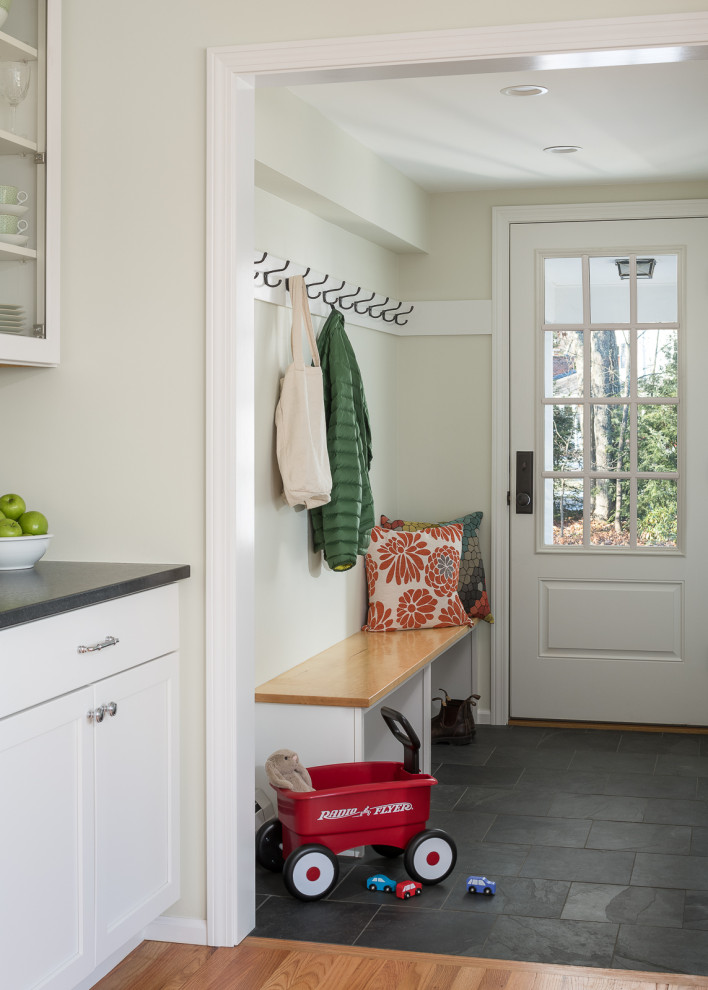 Photo of a small traditional boot room in Burlington with green walls, porcelain flooring, a single front door, a white front door and grey floors.