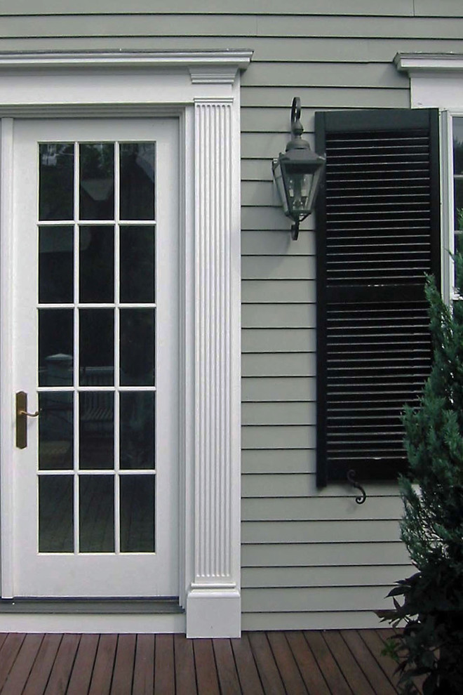 Mid-sized elegant medium tone wood floor and brown floor double front door photo in Boston with gray walls and a white front door